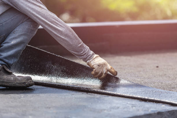 Professional Basement Waterproofing technician working in Riley, KS